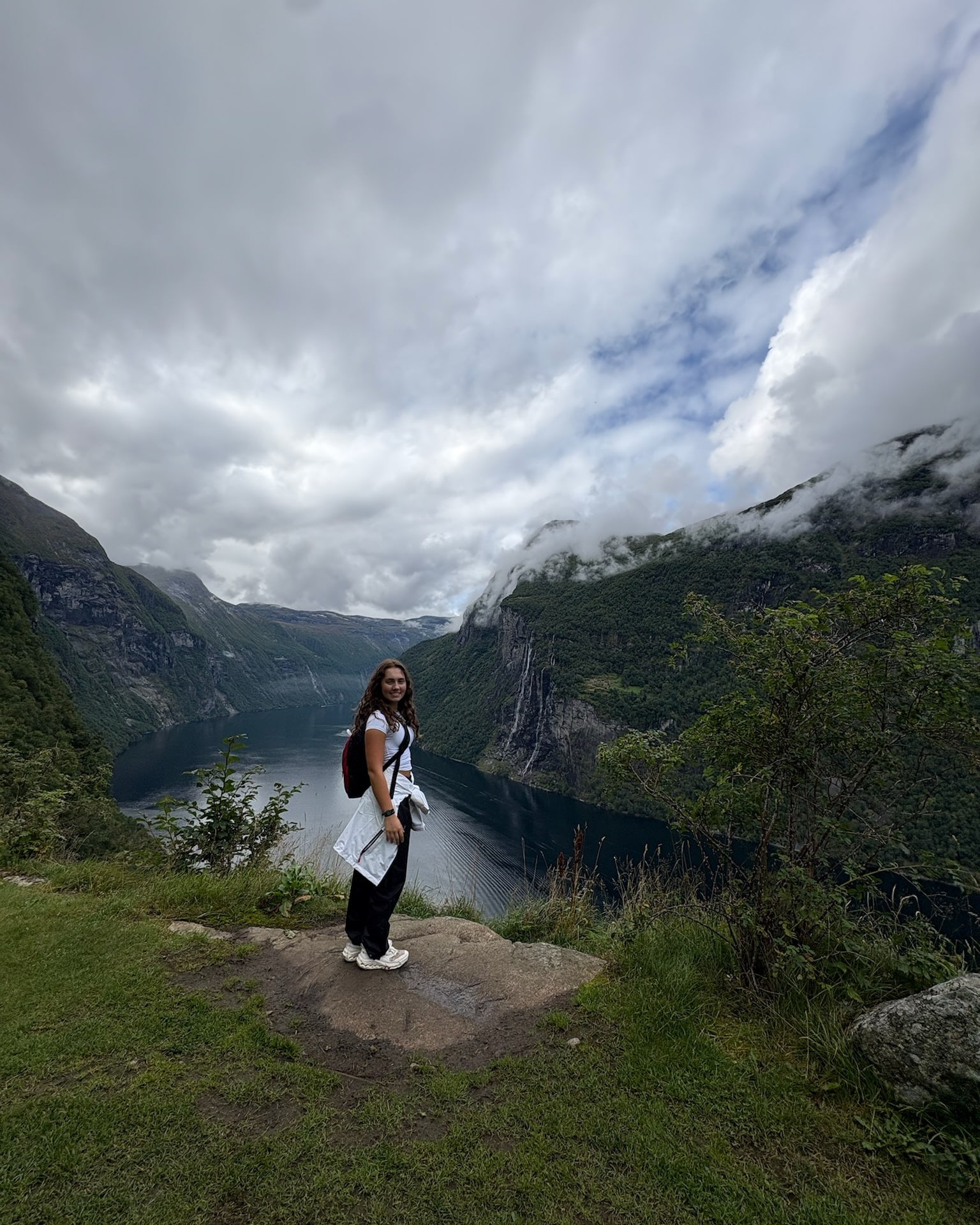 Isla above the Geirangerfjord, the Seven Sisters waterfall on the far cliff